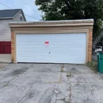 Classic white garage door at the front of the house